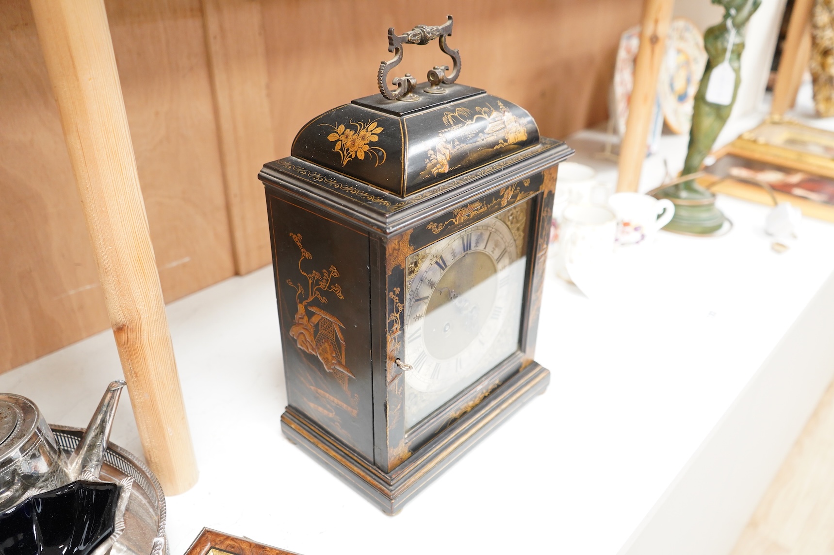An early 20th century chinoiserie japanned mantel clock with keys and pendulum, 39cm high